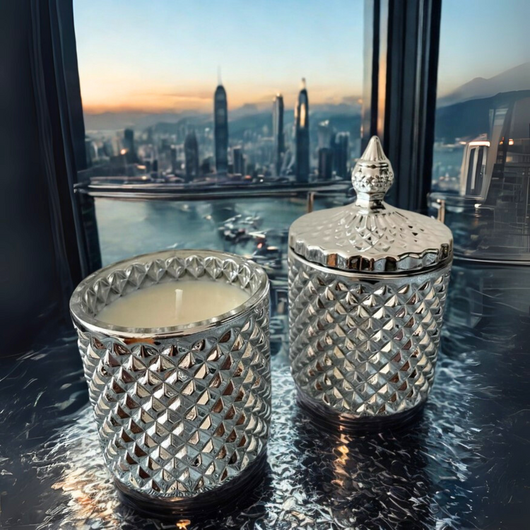 Silver geometric cut design glass jars with lids and filled with soy was candles