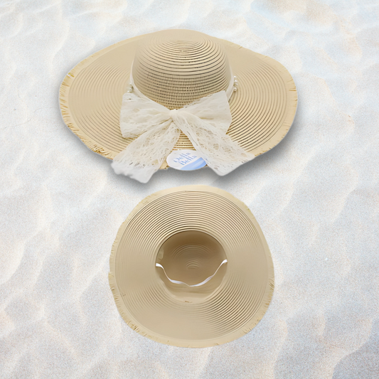 Two beige sun hats with lace details on a textured white surface