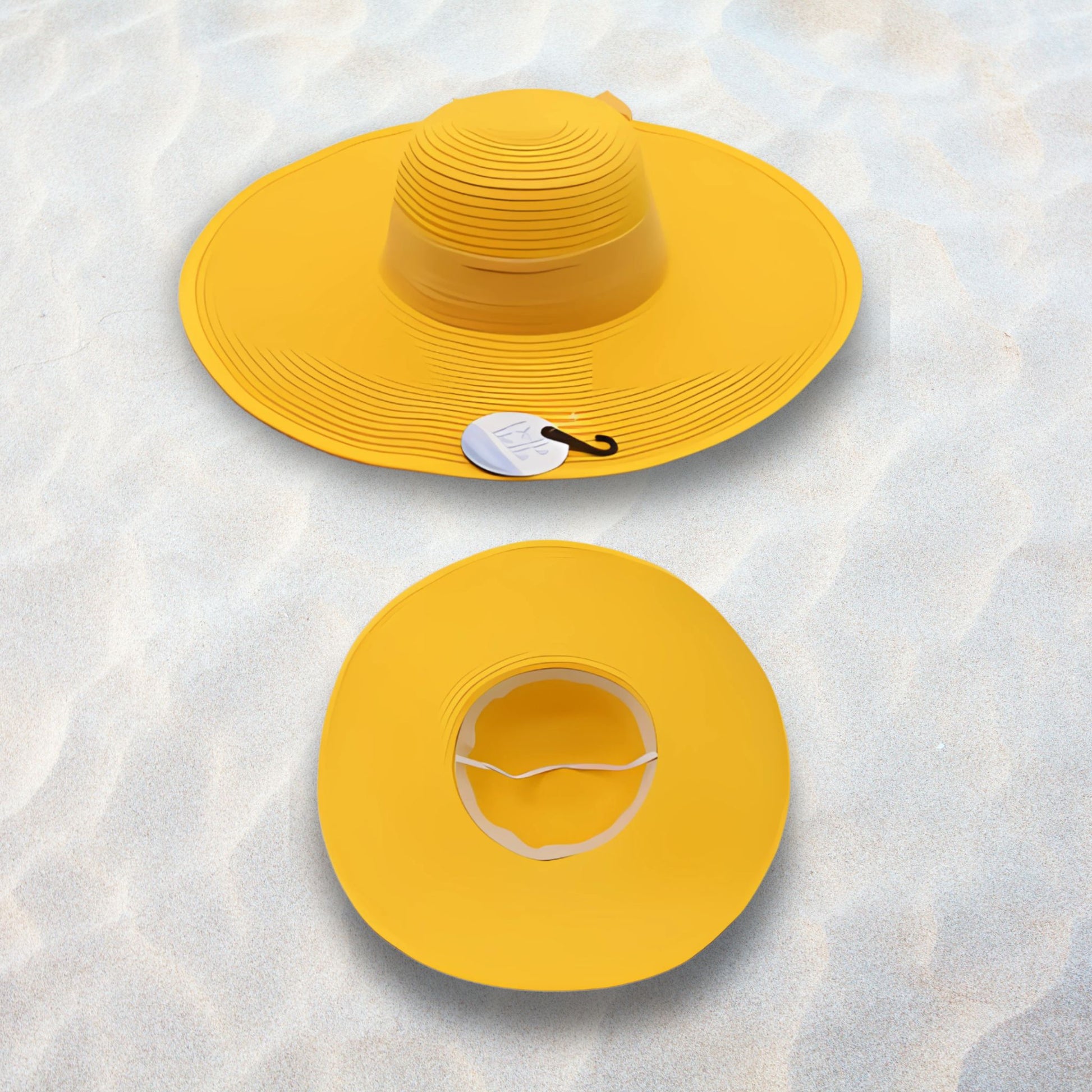 Two yellow sun hats on a textured white surface
