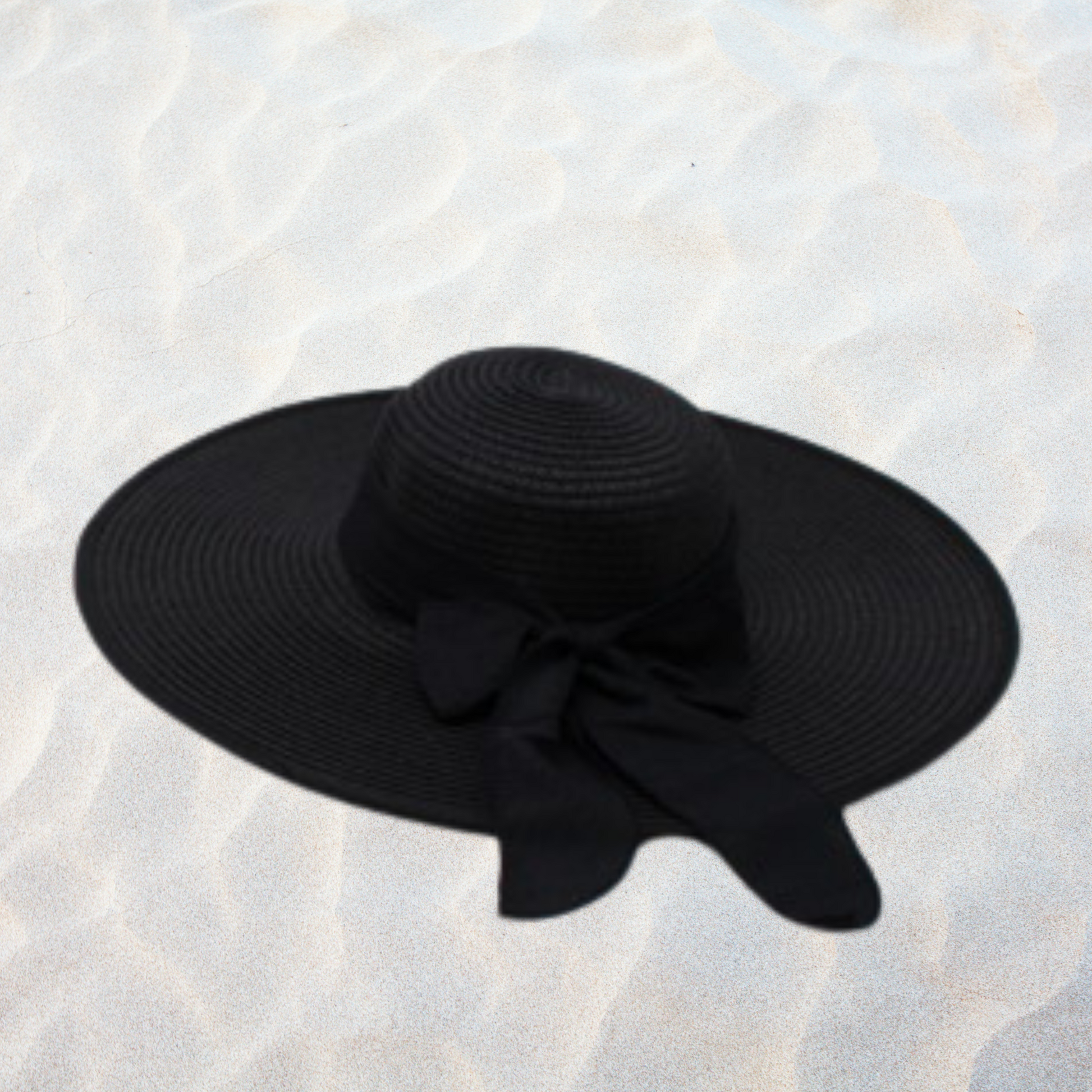 Black sun hat with a bow on a textured white background