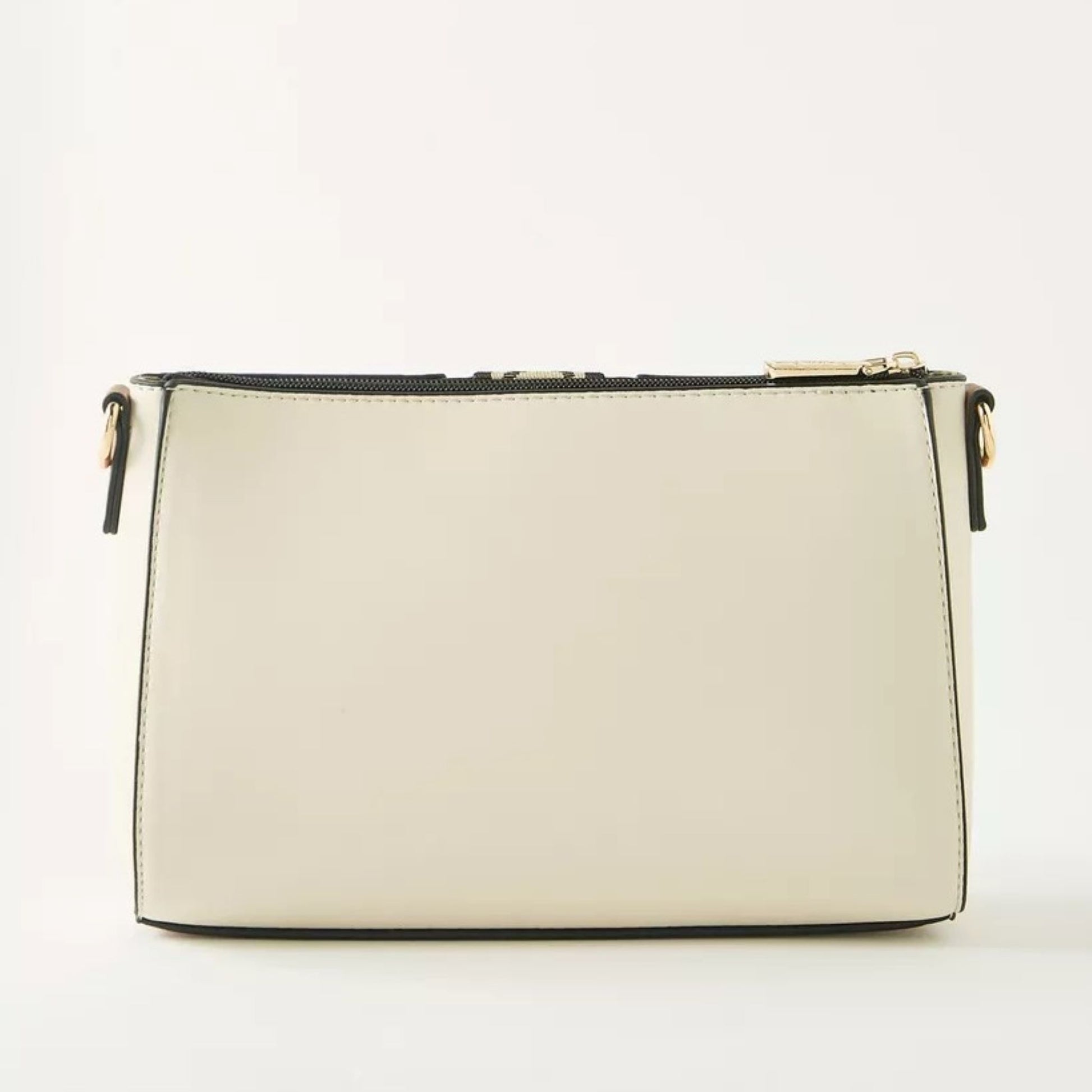 Beige pouch crossbody bag with removable and adjustable woven textured strap, with a monogram strip and removable tassel.