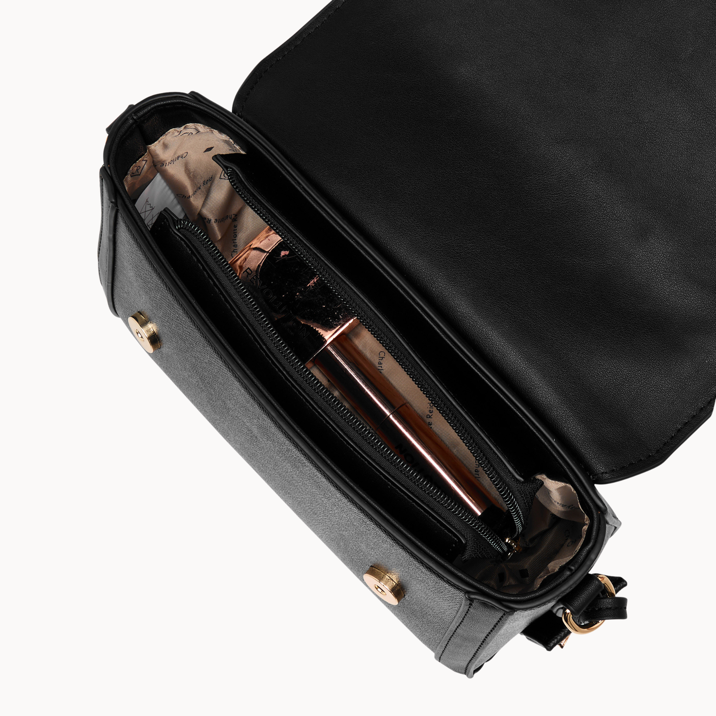 embroidered black floral crossbody bag in vegan leather. Features high-quality gold hardware & adjustable strap. Perfect for chic, everyday style.
