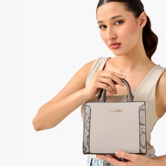 Stylish beige tote with snake-effect trim, zip closure, double handles & crossbody strap. Back slip pocket fits phone, wallet & daily essentials.