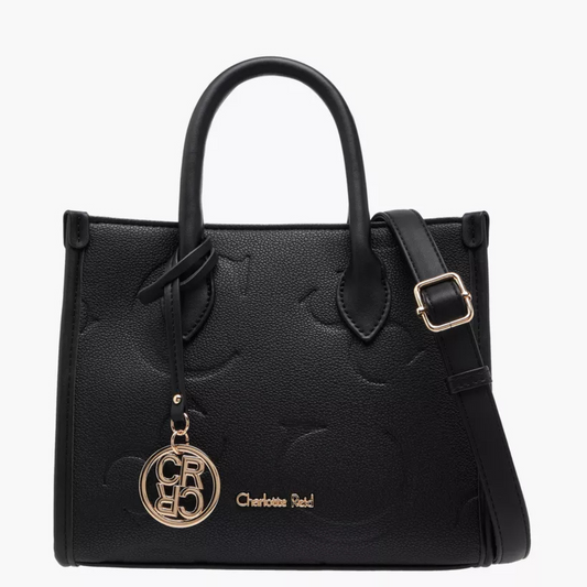 Black handbag with gold accents and a visible brand logo on a white background