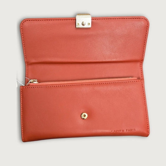 A red faux leather trifold wallet with a main compartment and multiple card slots, featuring a round emboss design on the clasp and gold hardware.