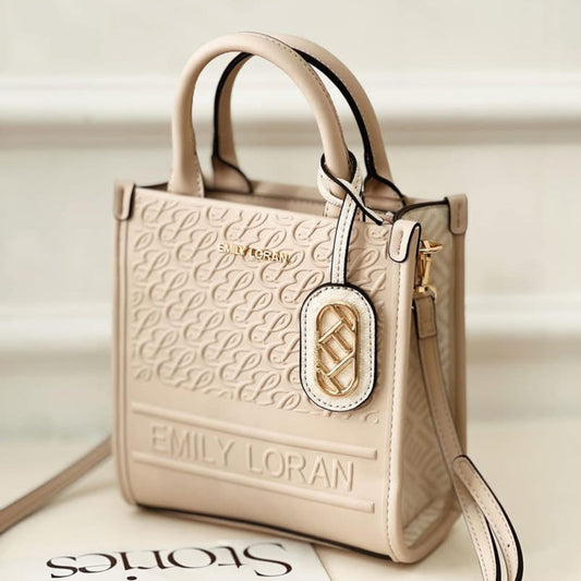 Beige handbag with 'EMILY LORAN' branding on a light background