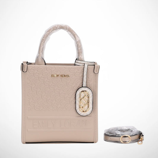 Beige handbag with matching belt on a white background