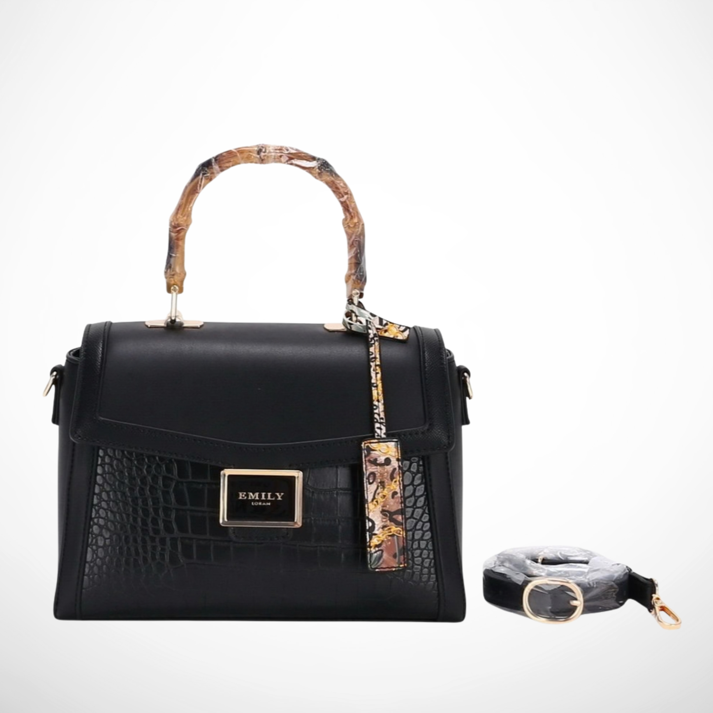 Black handbag with bamboo handle and detachable strap on a white background