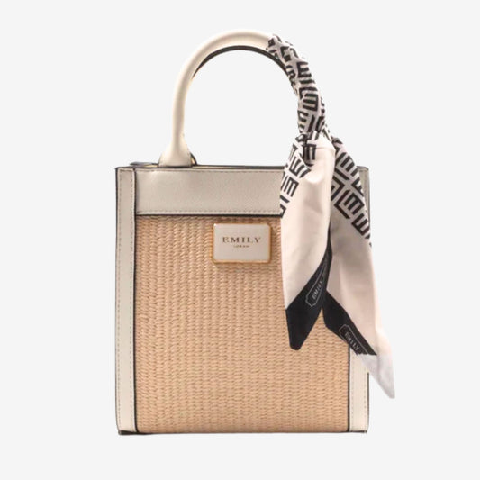 Handbag with a scarf draped over it on a white background