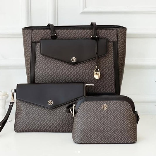 Set of three bags including a large tote, medium clutch, and small duffel bag with a geometric pattern on a white background.