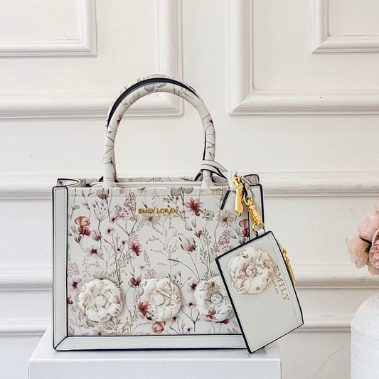 Floral-patterned handbag with matching pouch on a white background