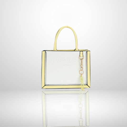 London structured tote bag with premium suede-touch finish, embossed logo, floral print trim, gold-tone hardware, branded charm, and top handles, available in multiple elegant colours.