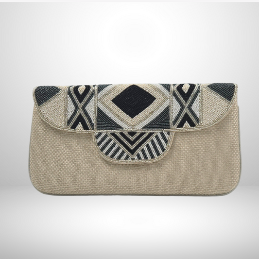 Cream clutch bag with geometric black and white pattern on a light gray background