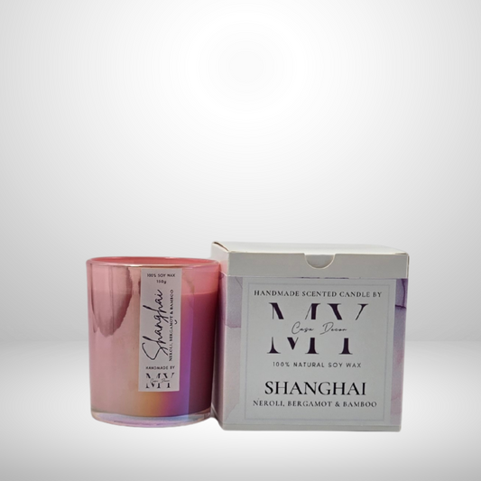 Scented candle in a clear pink glass holder next to a white box by MY Casa Decor and InStyle Fashion HK