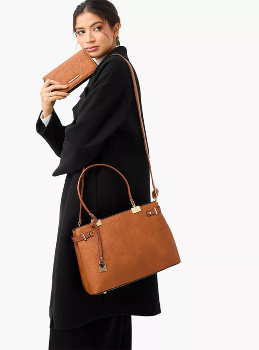 lady holding a Brown 3 piece vegan faux leather handbag set featuring a large shoulder tote, a saddle flapover crossbody shoulder sling and a zip-around wallet pouch.
