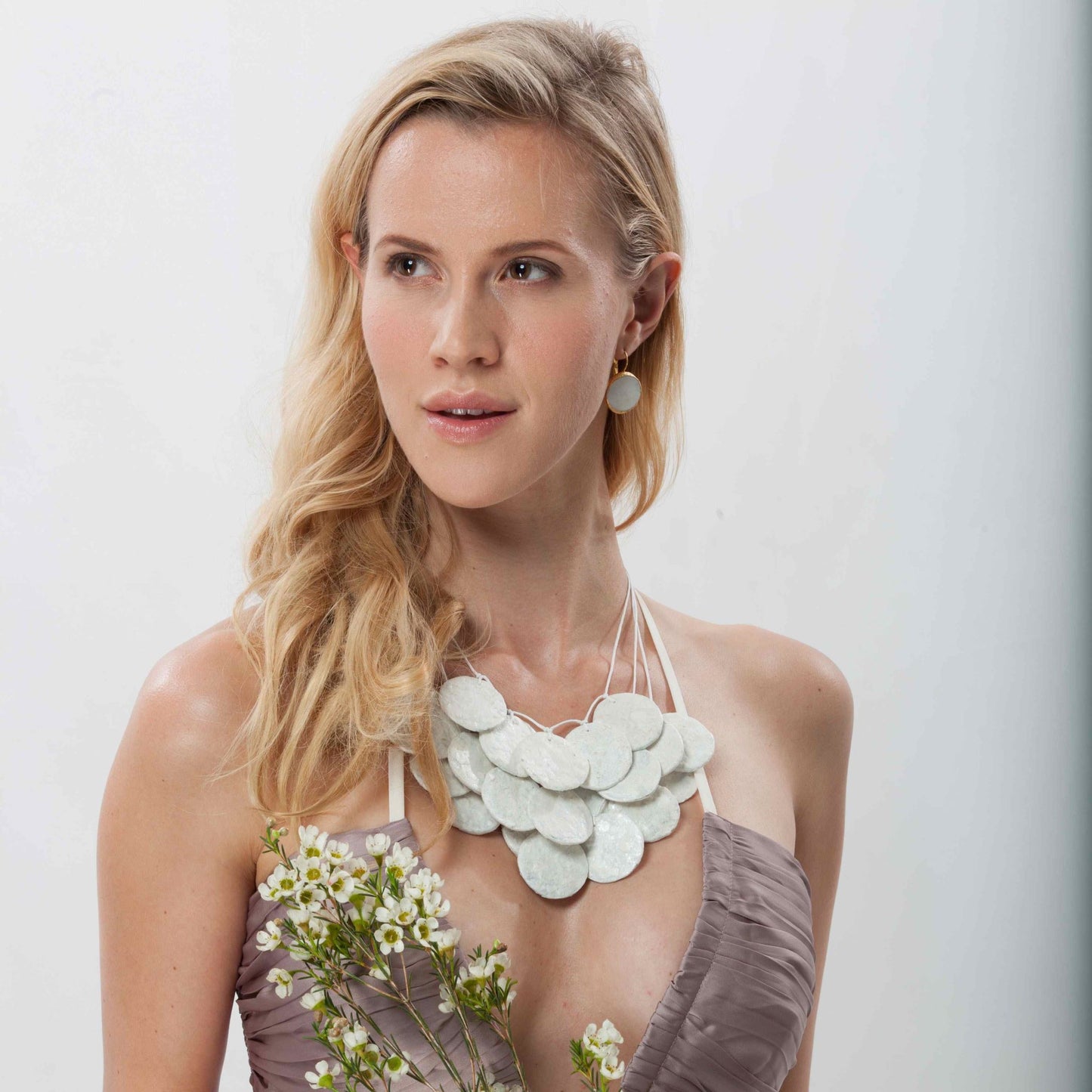 Handmade from recycled paper and leather & finished with a special waterproof applique, this head-turning statement piece is exclusively from InStyle Fashion HK.