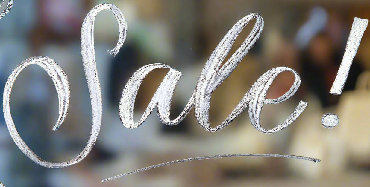 Sale sign with blurred indoor background
