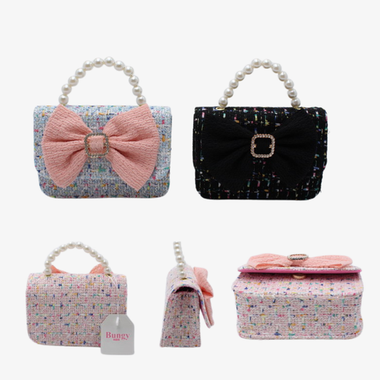 Children's floral tweed mini handbag with bow decoration, pearl handle, and gold chain strap, available in blue and black color options.