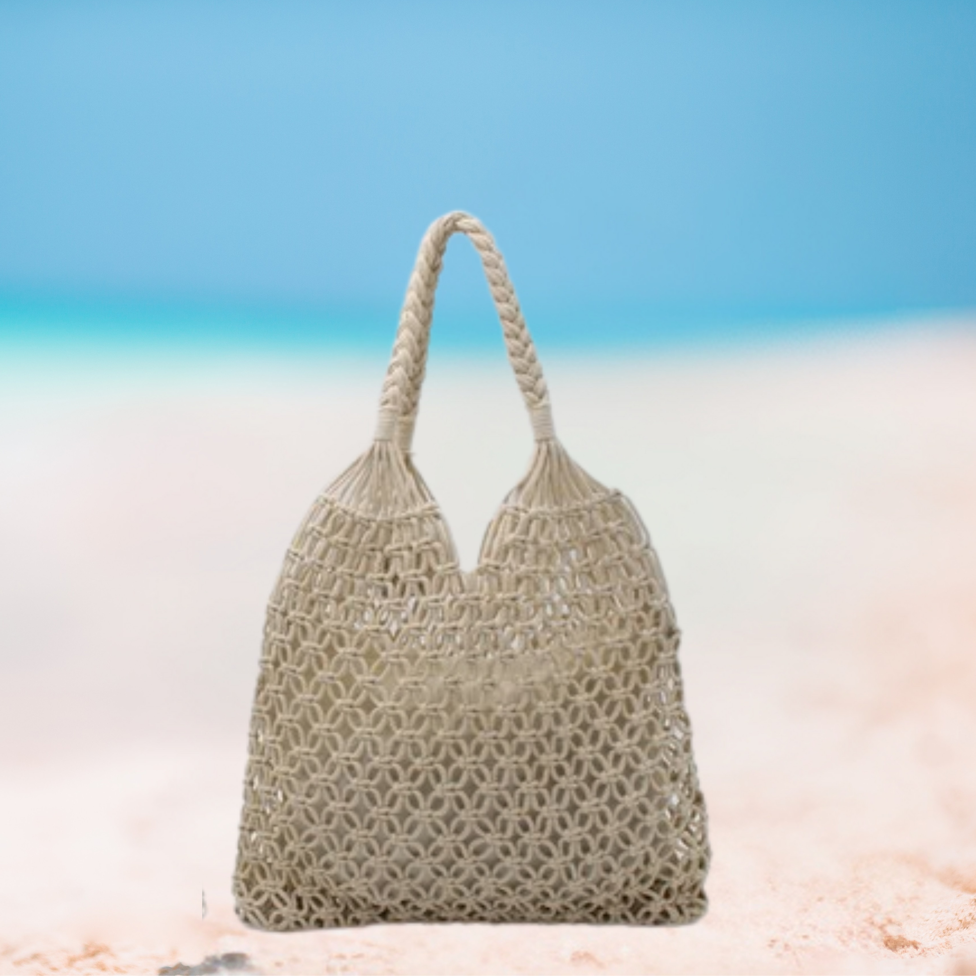 Woven handbag on a beach with a blue sky background