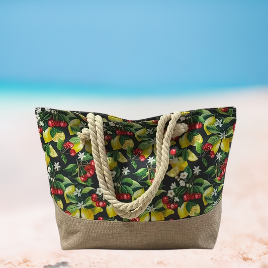 Tote bag with fruit pattern and rope handles on a beach setting