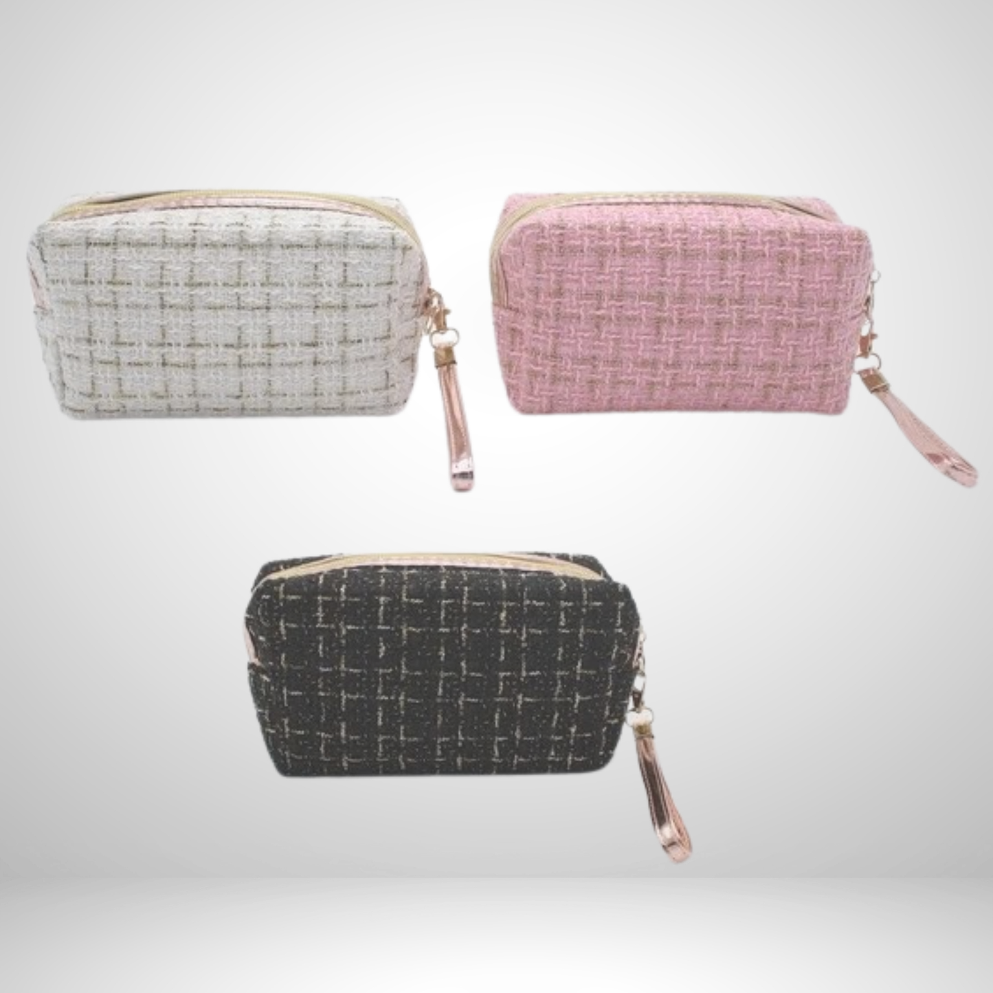 Refined tweed cosmetic bag with a luxe gold zipper and wrist strap. Compact for travel or daily use, keeping makeup secure. Available in pink, white, or black!
