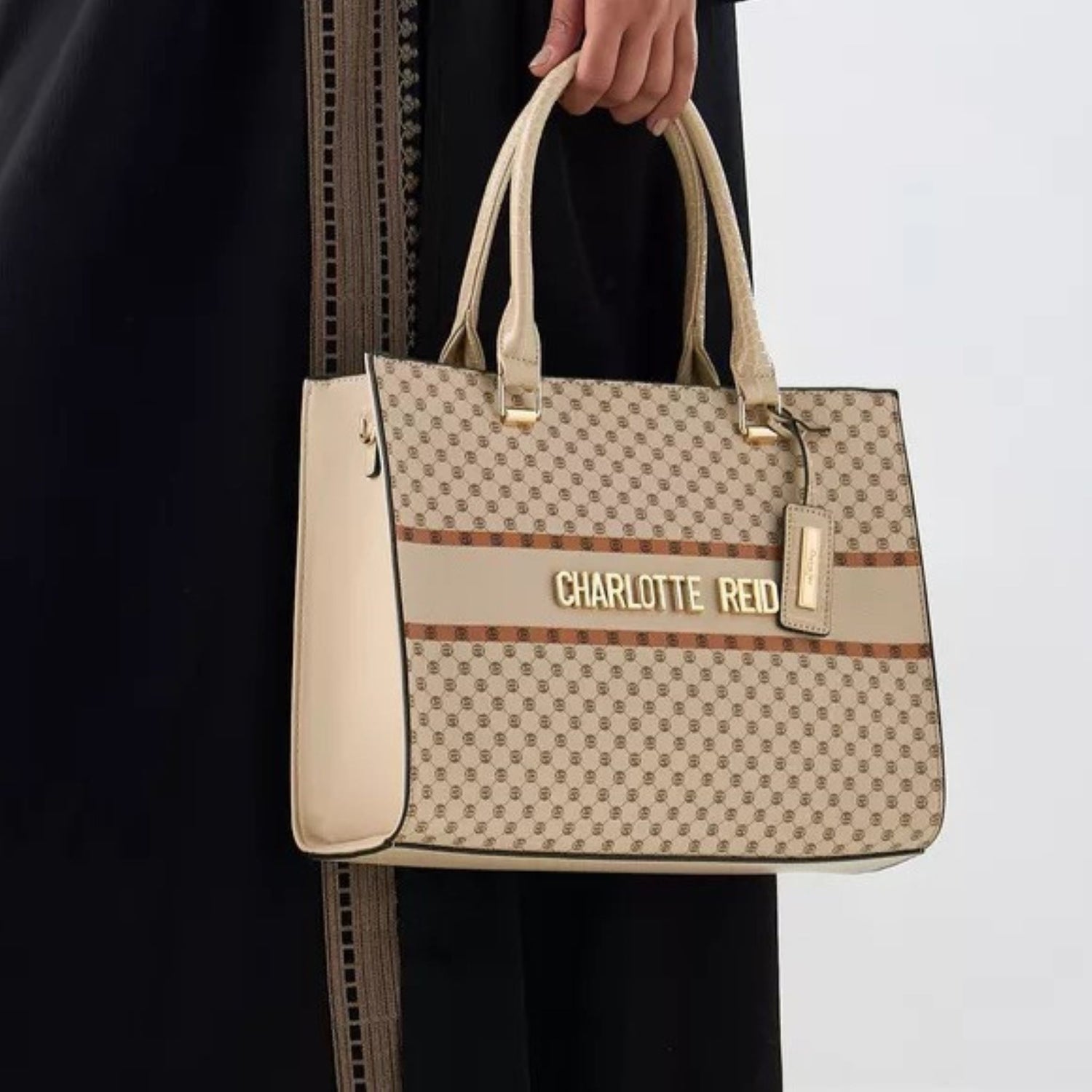 Lightweight faux‑leather tote with monogram print, top zipper, double handles, and work‑friendly size—perfect everyday bag for office, travel, and casual wear.