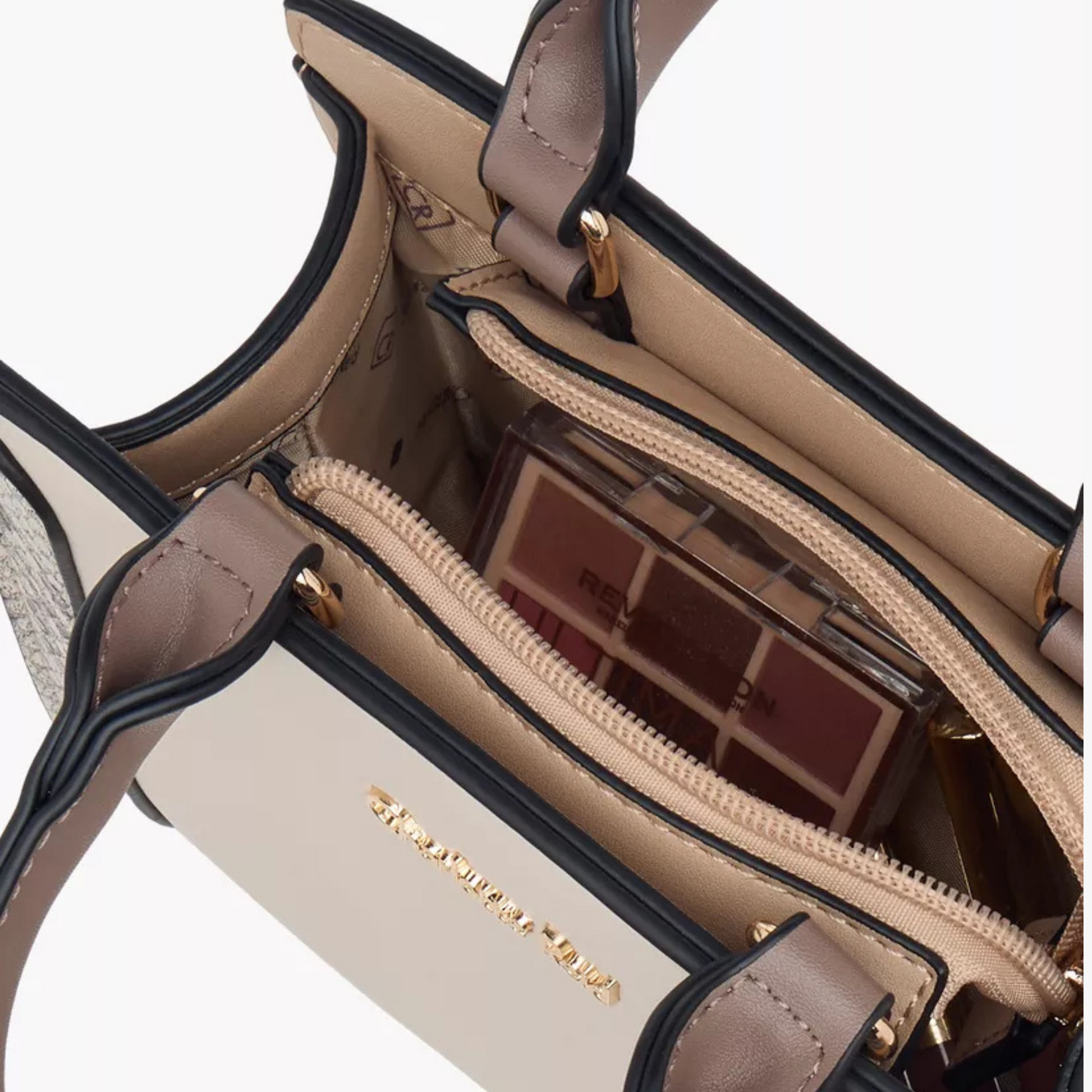 Stylish beige tote with snake-effect trim, zip closure, double handles & crossbody strap. Back slip pocket fits phone, wallet & daily essentials.