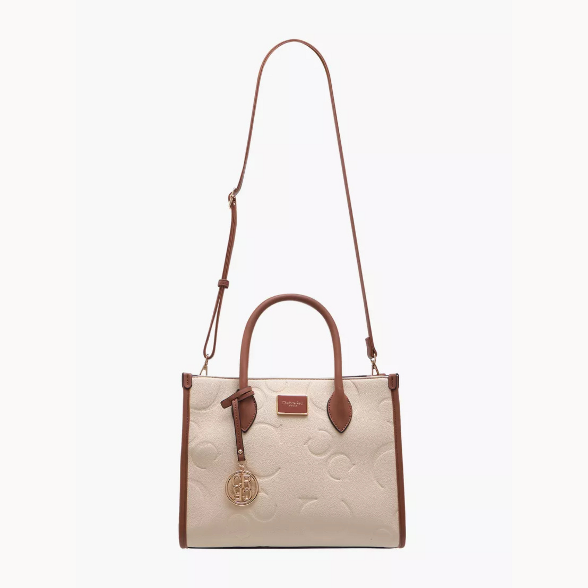 Elegant embossed beige tote bag. Adjustable crossbody strap, roomy interior, and phone/key pocket by InStyle Fashion Hong Kong.