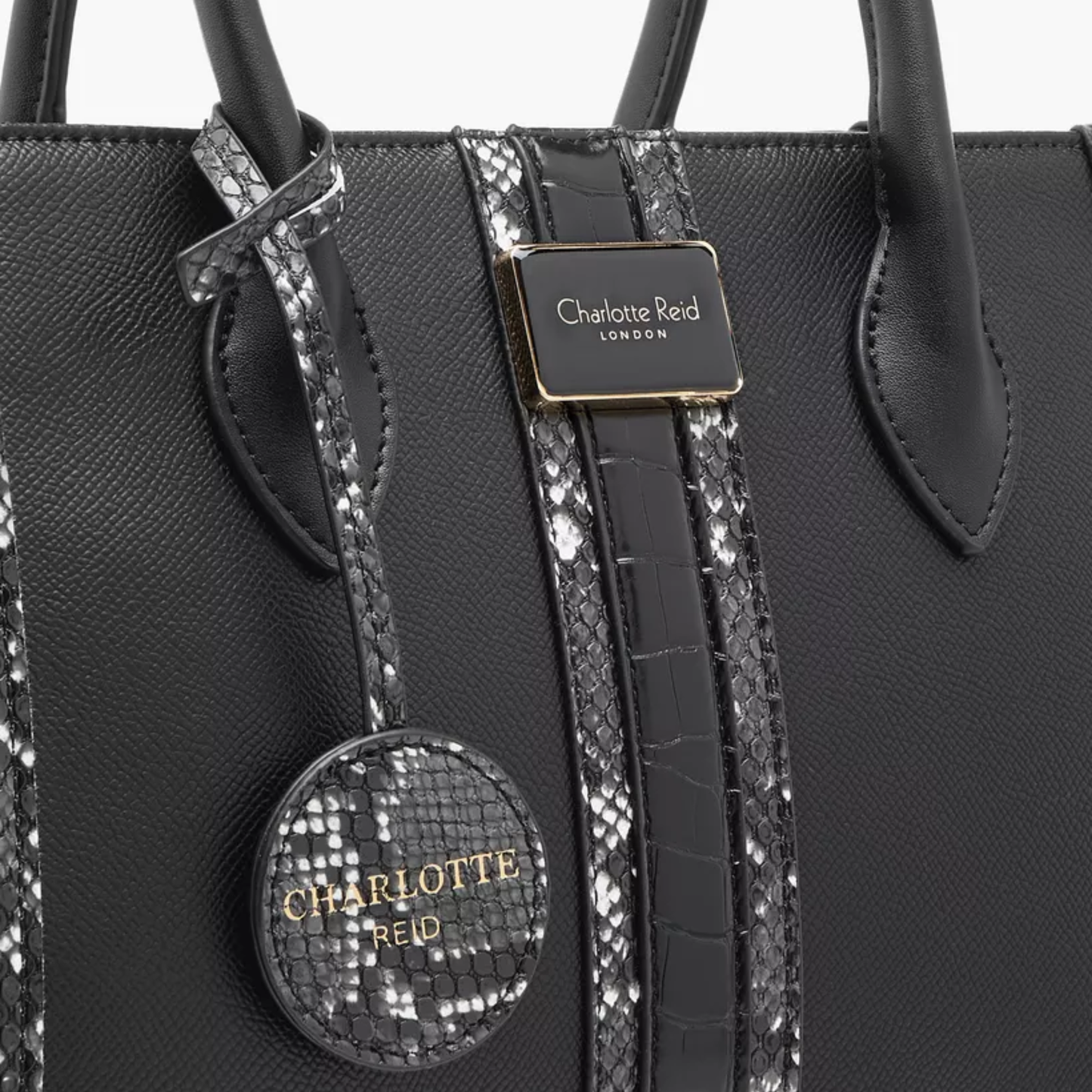 Discover our premium black tote handbag with a sleek structured design, detachable strap, and chic charm—perfect for work, travel, or everyday elegance.