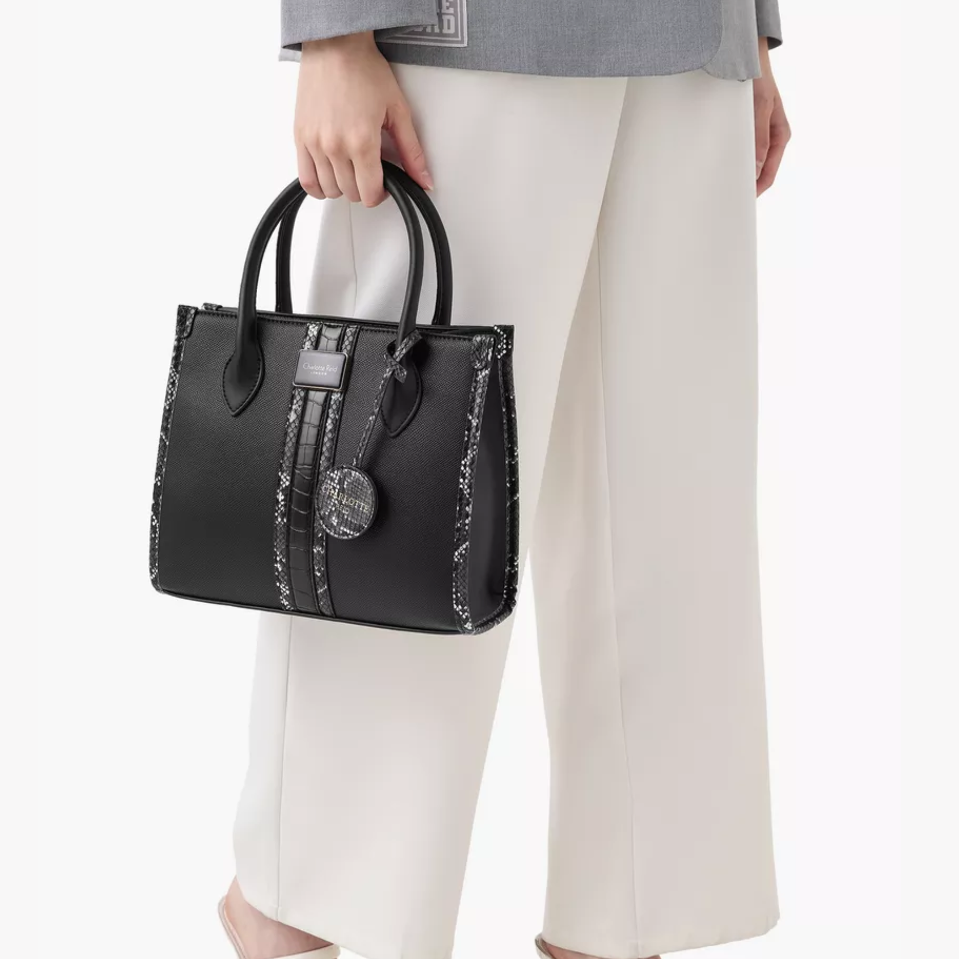 Discover our premium black tote handbag with a sleek structured design, detachable strap, and chic charm—perfect for work, travel, or everyday elegance.