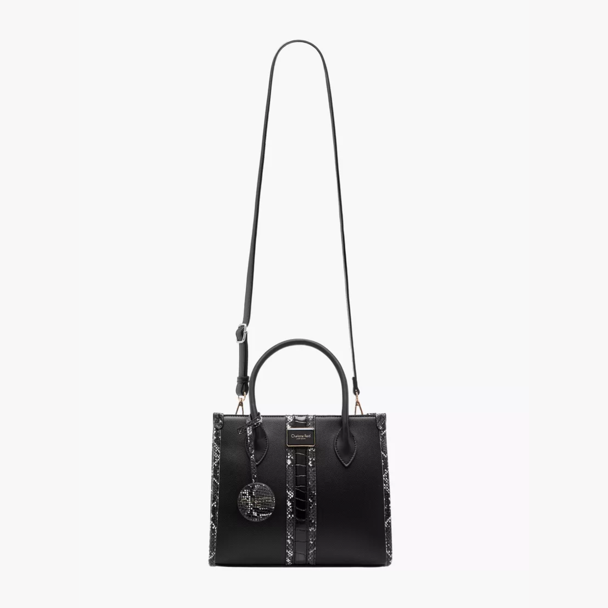 Discover our premium black tote handbag with a sleek structured design, detachable strap, and chic charm—perfect for work, travel, or everyday elegance.