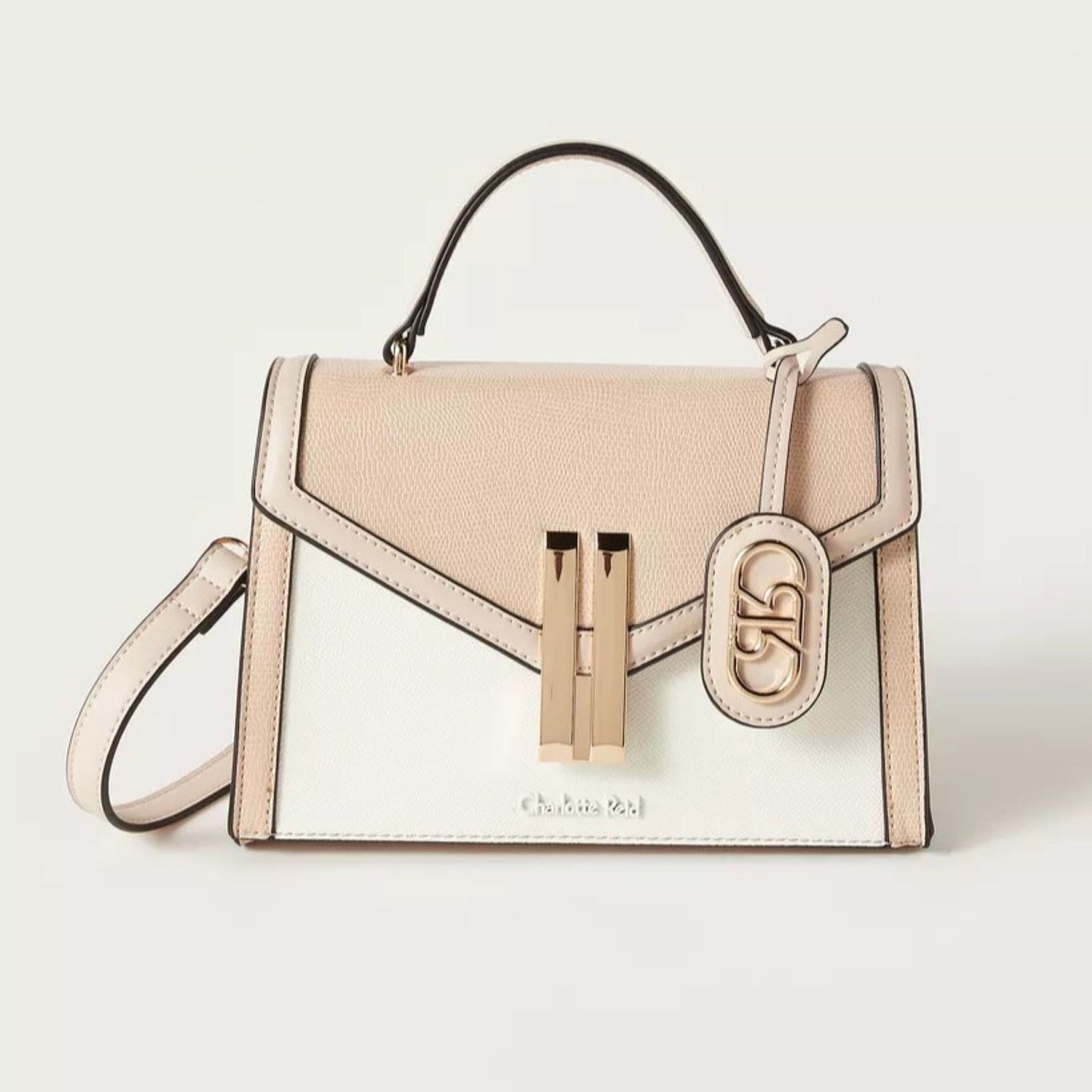 Satchel tote handbag , magnetic flap closure, adjustable removable strap, top handle in beige and white combination.  