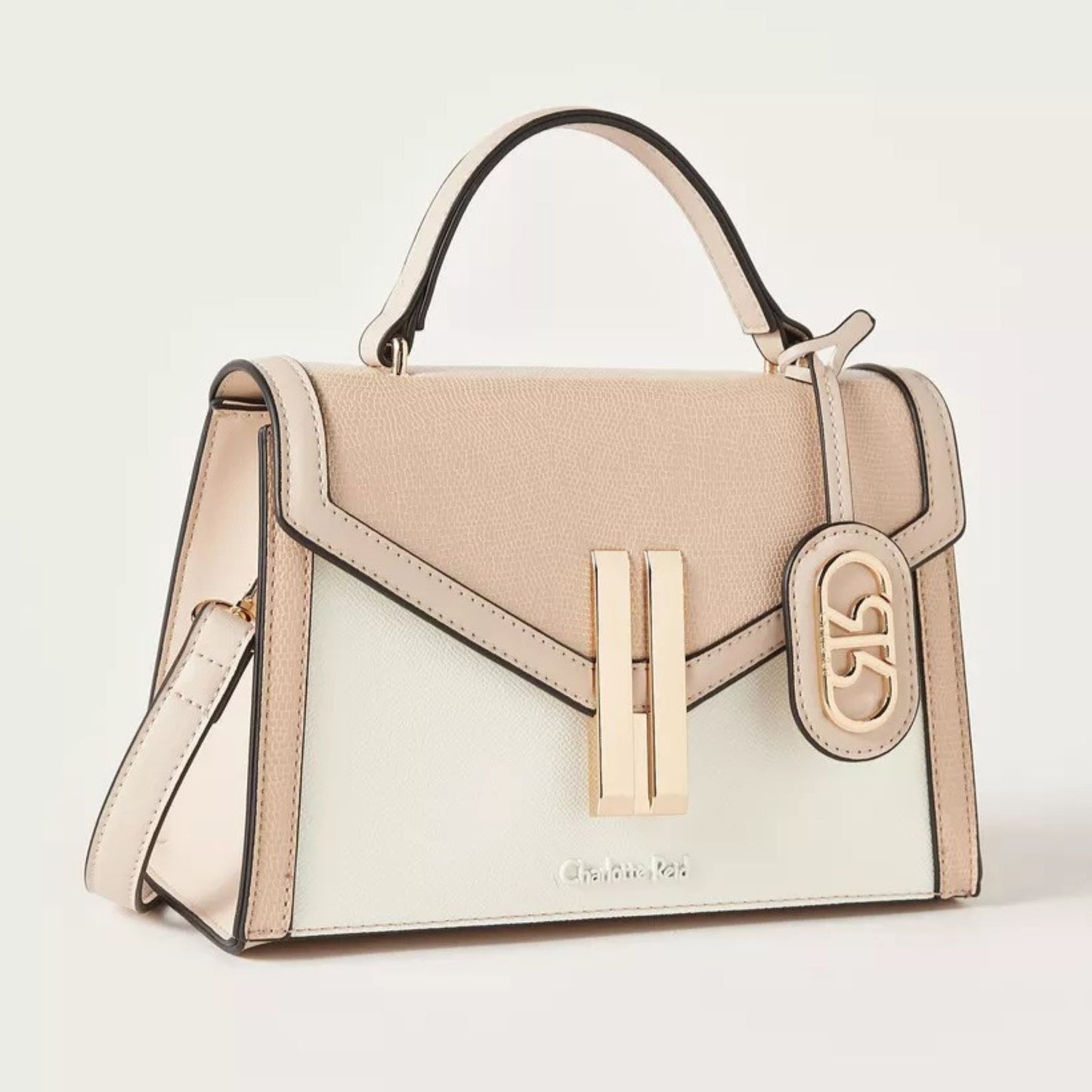 Satchel tote handbag , magnetic flap closure, adjustable removable strap, top handle in beige and white combination.  