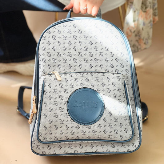 Blue Backpack with Zipped Pocket & Monogram Detail