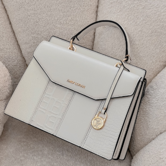 Satchel bag featuring a dual compartment with flaps and magnetic closure, top grab handle,  additional long removable strap.