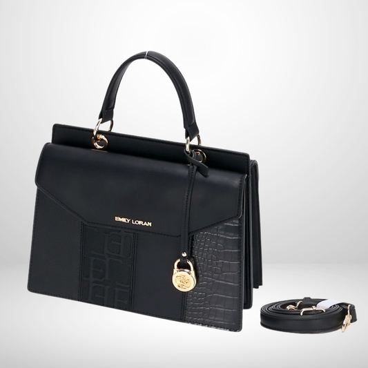 Black handbag with gold accents and a detachable strap on a light gray background