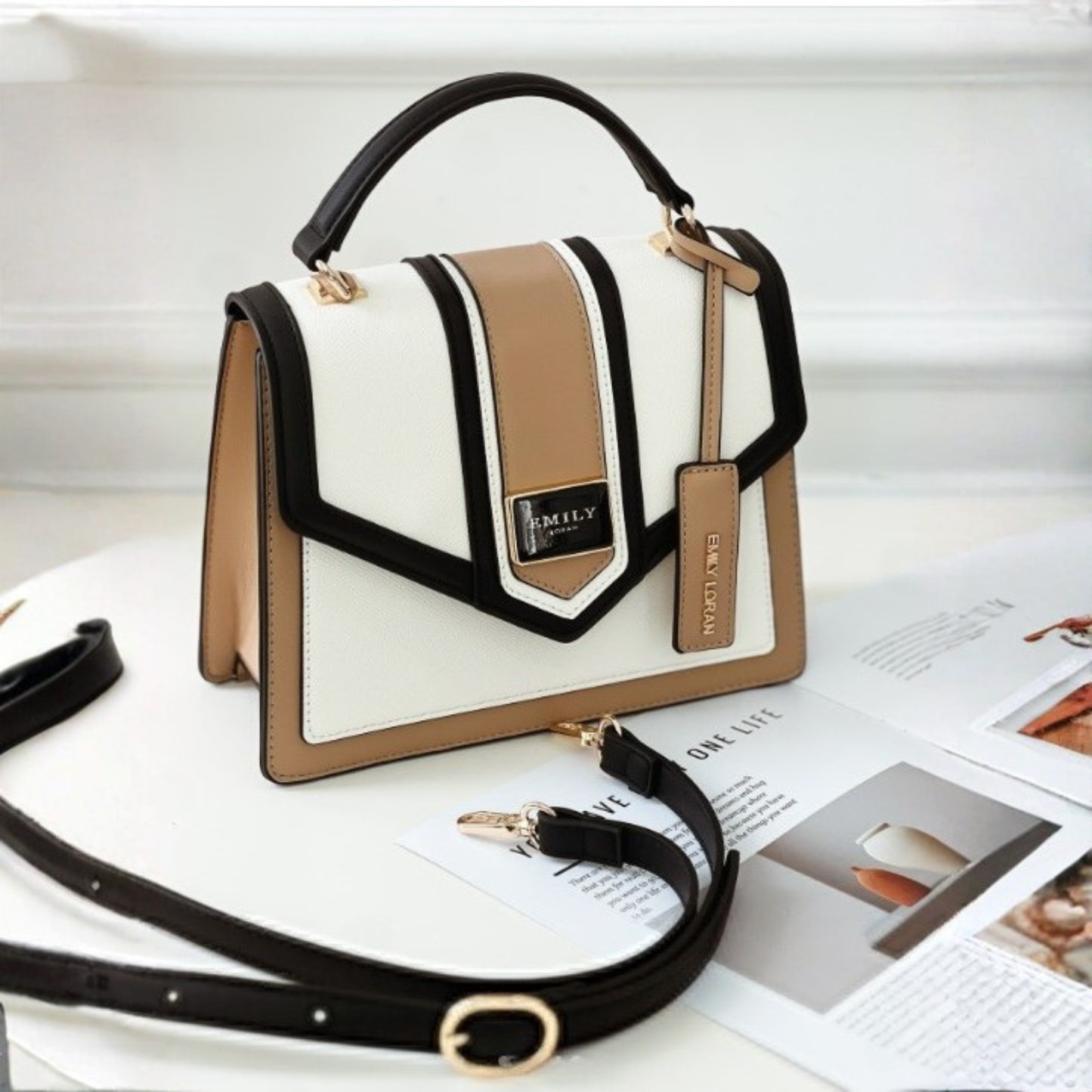 Structured satchel in beige, white & black color‑block. Geometric flap, top handle & detachable strap make this elegant handbag perfect for daily use.