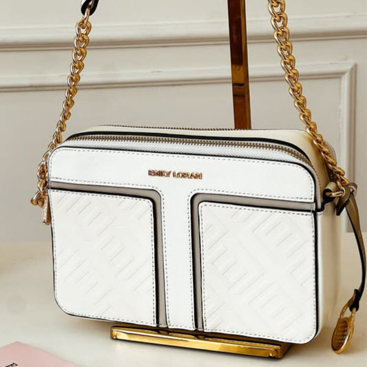 White handbag with gold chain strap on a light background