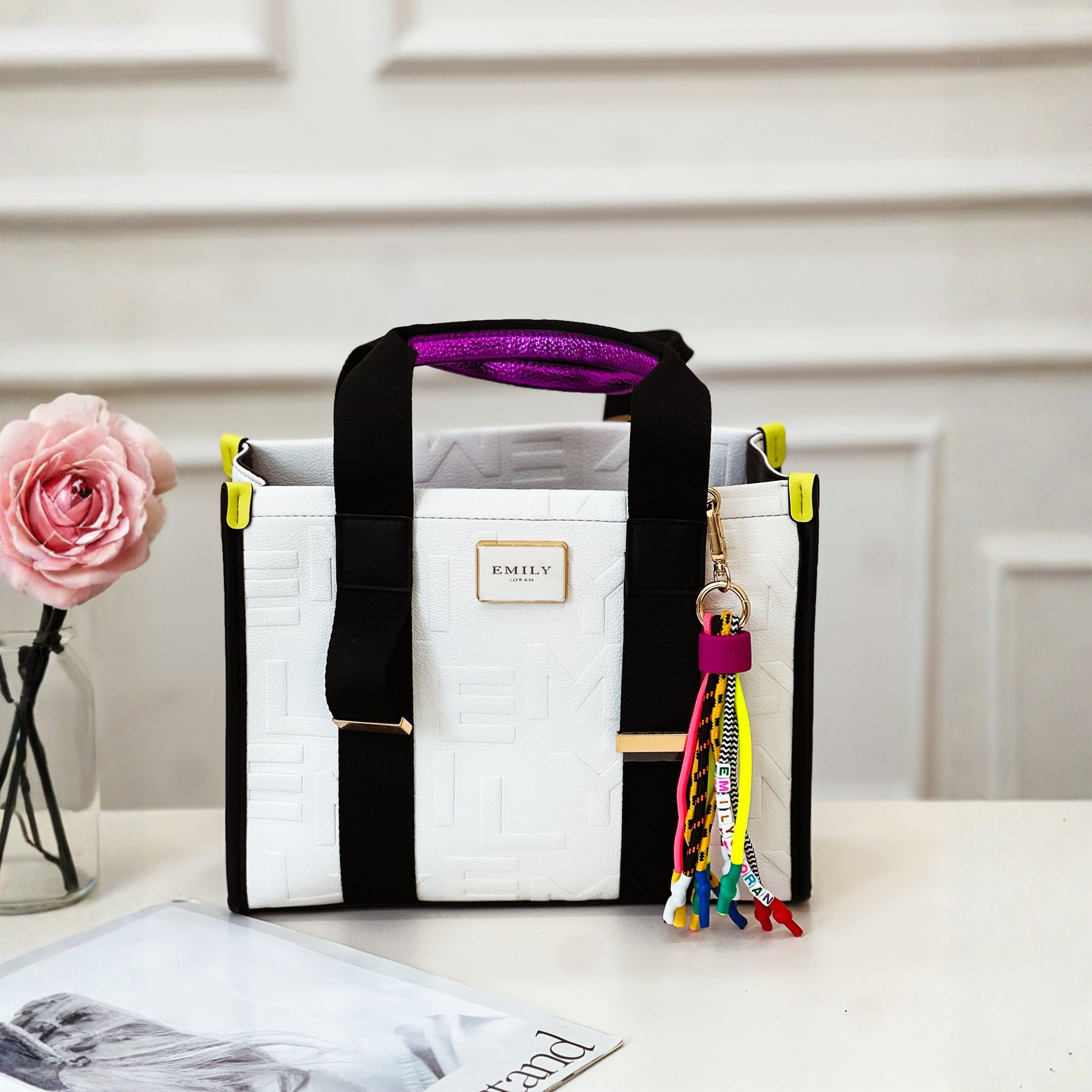 Smart satchel shopper with woven handles, long strap & drawstring top. Stylish monogram print, contrast trim & tassel detail. Perfect daily bag with flexible storage