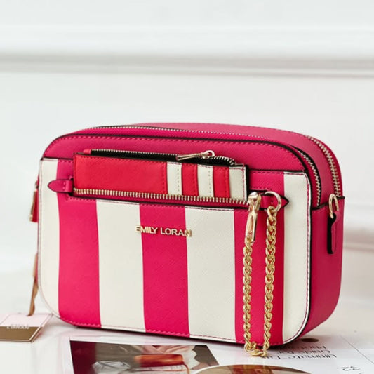 Pink and white striped handbag with gold chain strap on a light background