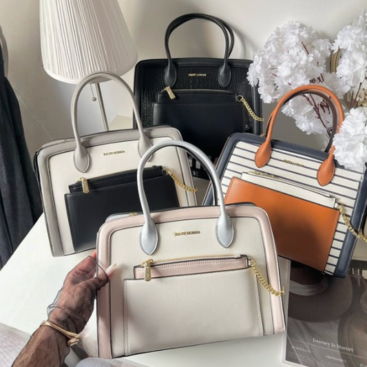 Structured women's top handle handbag with detachable zip pouch, front zip pocket, gold chain detail, available in black, pastel and striped designs.