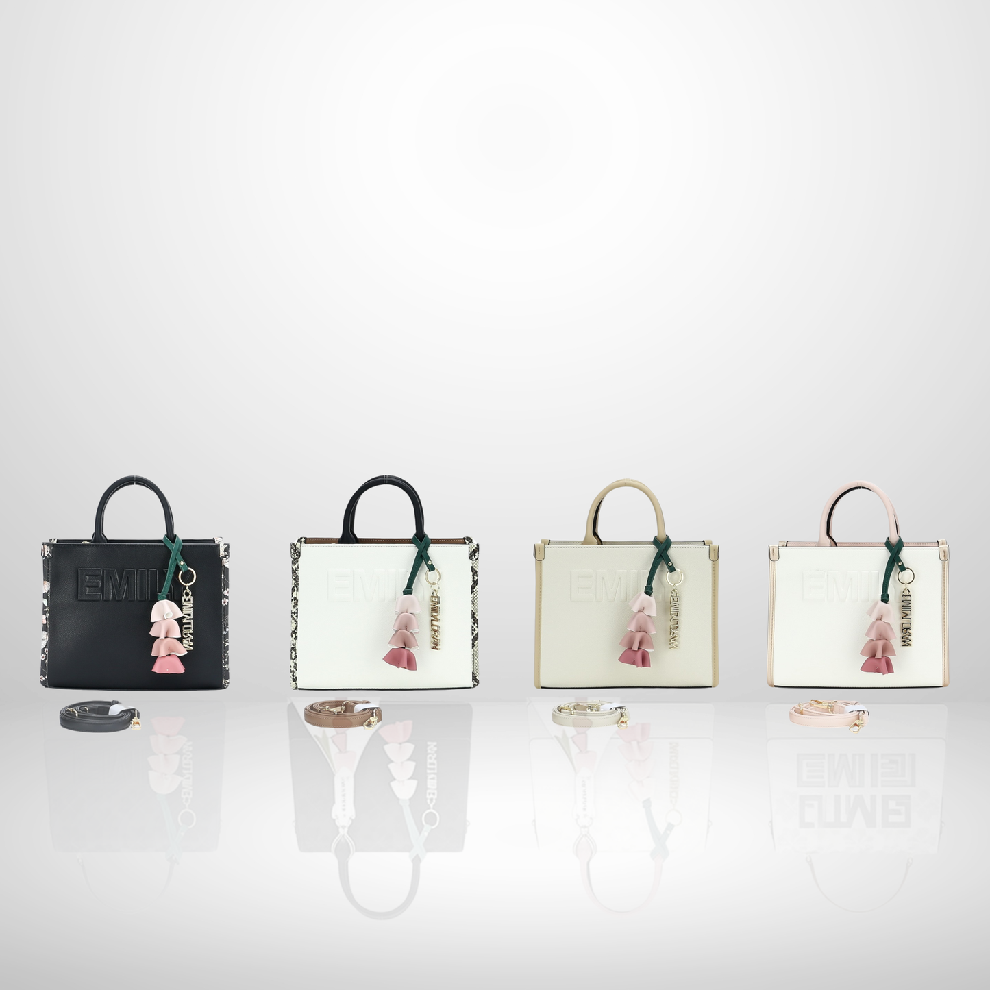 Elegant women's structured tote bag with embossed front logo, floral tassel keychain charm, top handles, and detachable shoulder strap, available in black, white, cream, and blush pink.