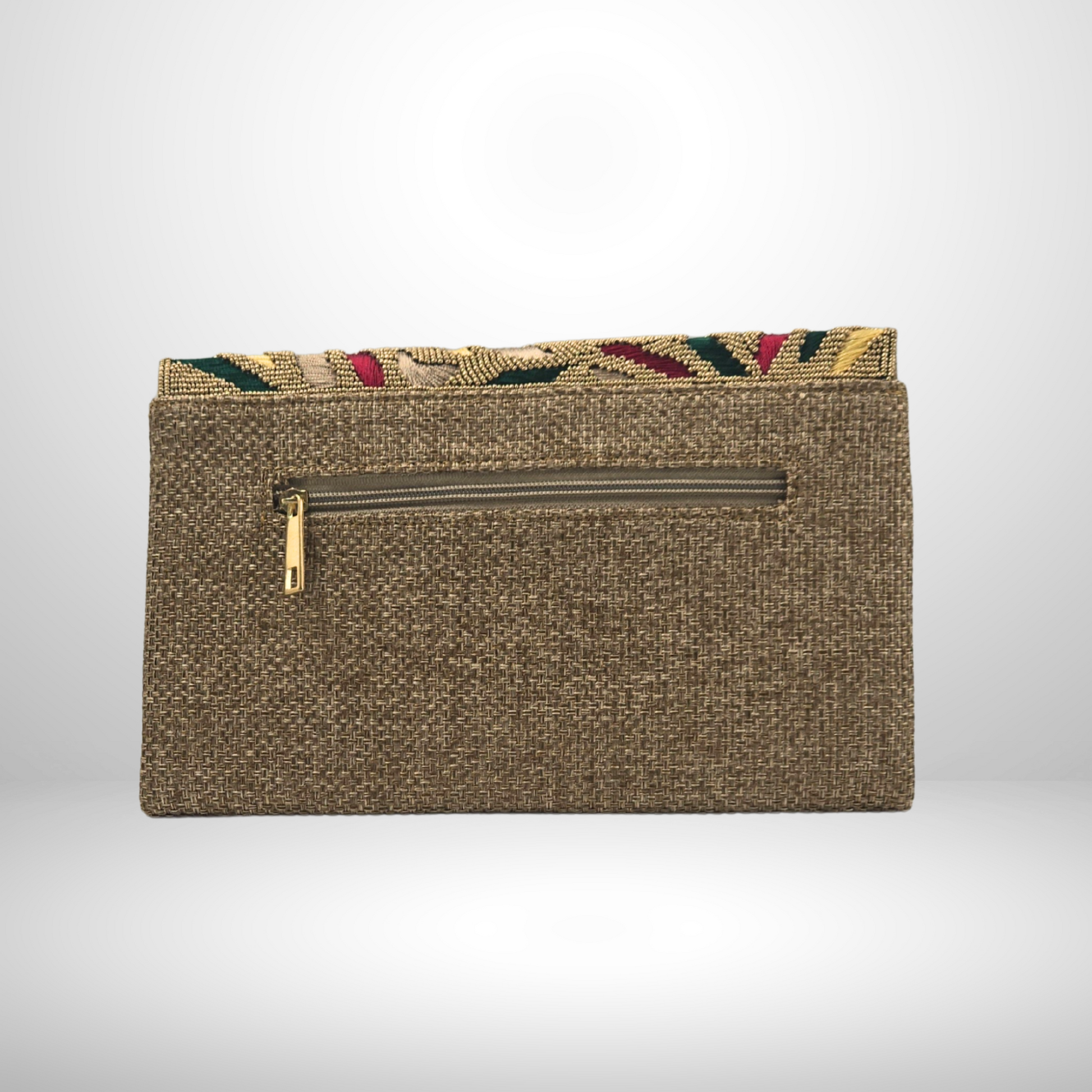 Textured clutch bag with a colorful top flap on a light gray background