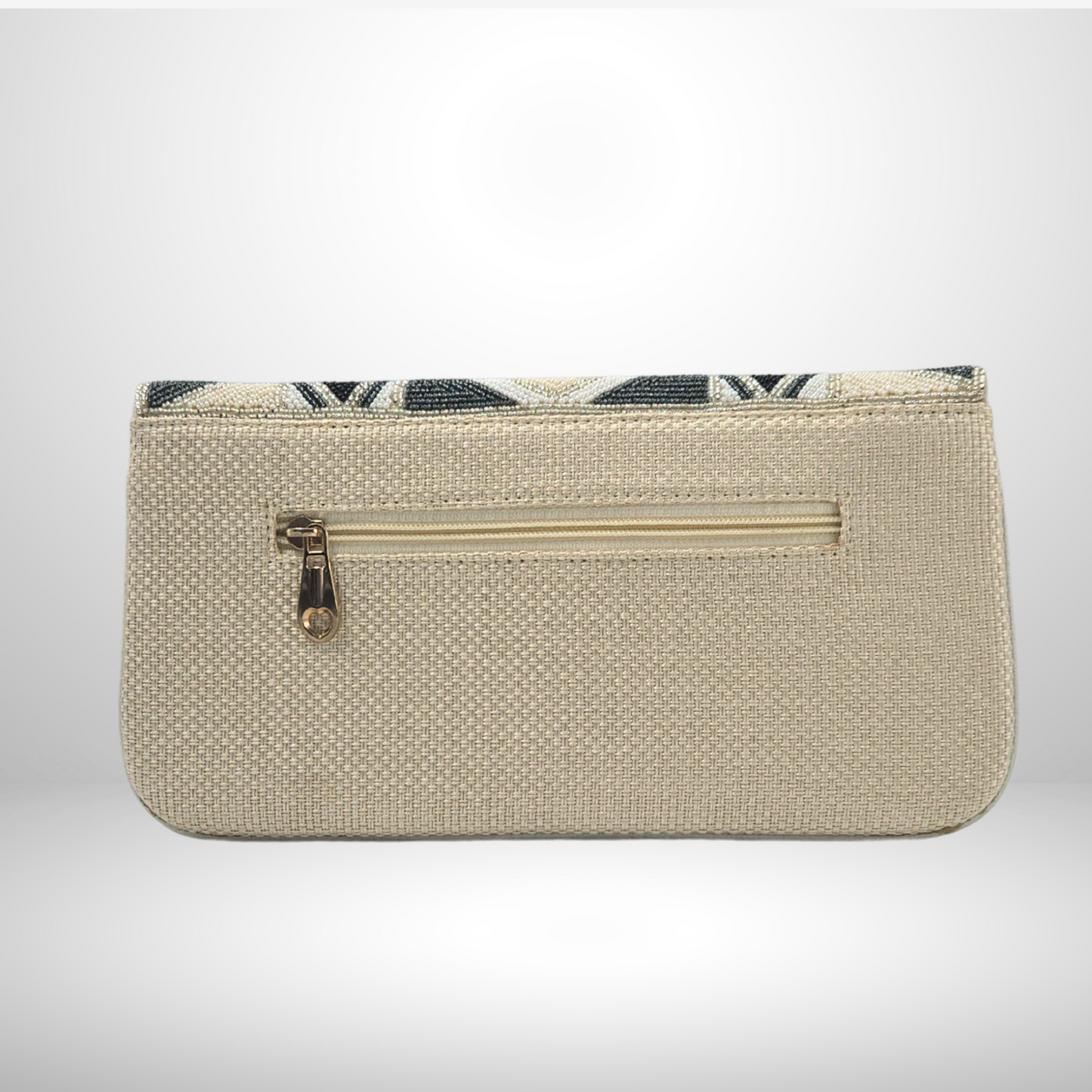 Cream clutch bag with a gold zipper on a light gray background