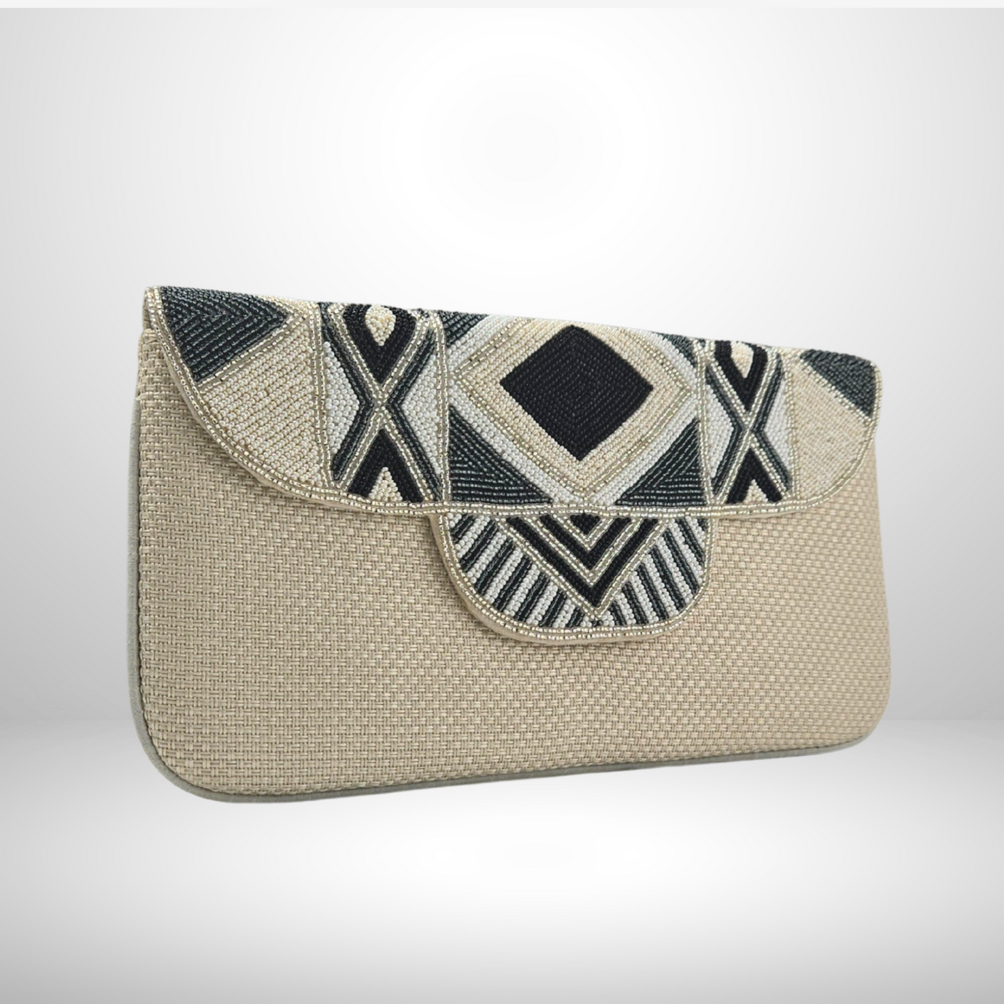 Cream clutch bag with geometric black and white pattern on a light gray background