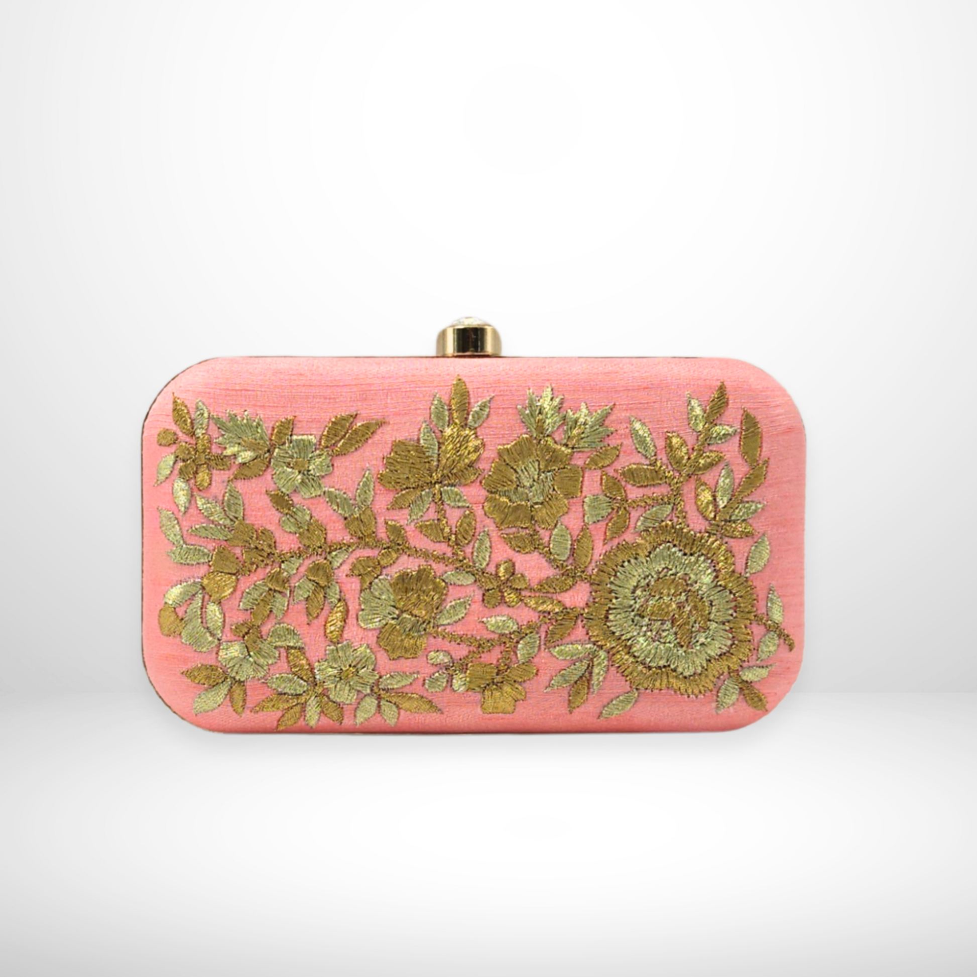 Pink clutch bag with gold floral embroidery on a white background