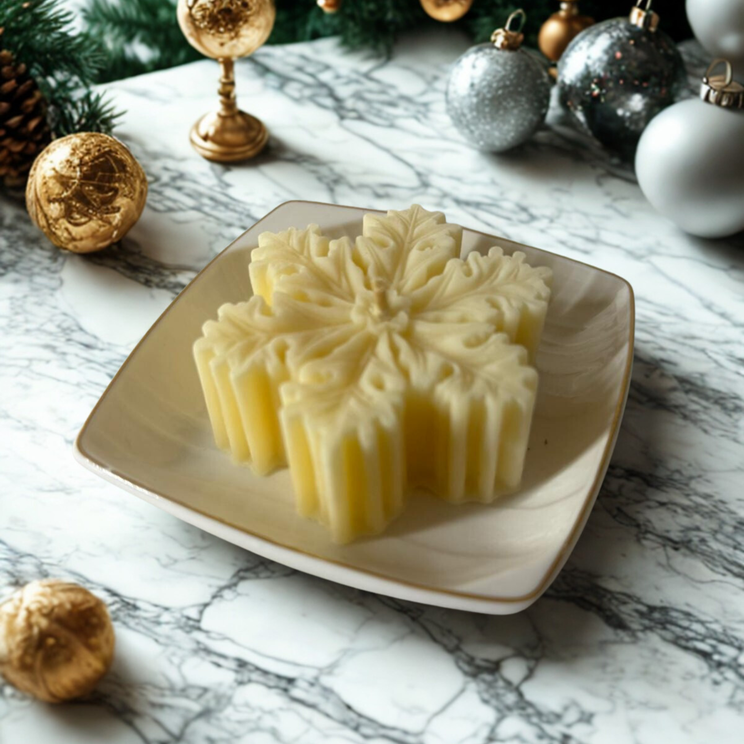 Shop elegant snowflake candles for festive décor. Comes with a decorative ceramic plate, and packed in a silver gift box with white bow for holiday gifting.