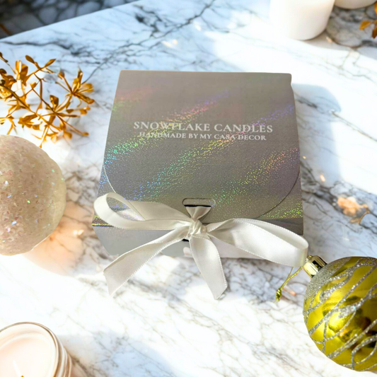 Shop elegant snowflake candles for festive décor. Comes with a decorative ceramic plate, and packed in a silver gift box with white bow for holiday gifting.